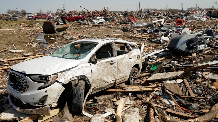 A vehicle awaits removal Saturday March 25, 2023, after getting destroyed by a Friday night tornado that hit Rolling Fork, Miss. Emergency officials in Mississippi say several people have been killed by tornadoes that tore through the state on Friday night, destroying buildings and knocking out power as severe weather produced hail the size of golf balls moved through several southern states.