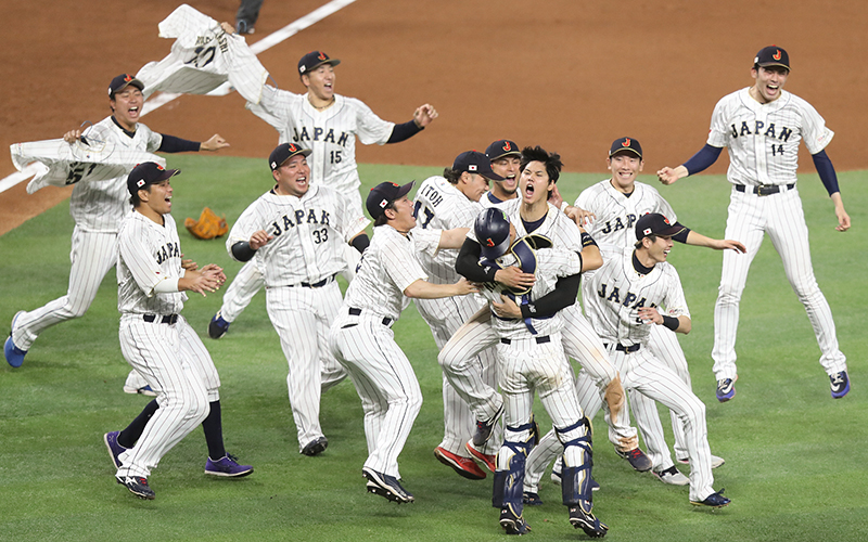 Japan's Shohei Ohtani celebrates with catcher Yuhei Nakamura and teammates after a 3-2 win over team USA