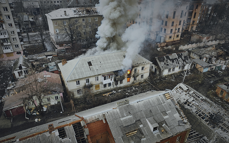 Smoke rises from a burning building in an aerial view of Bakhmut