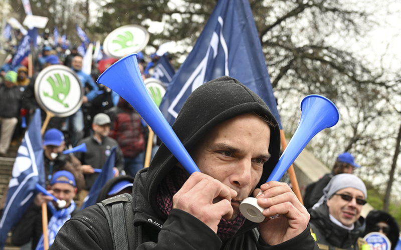 Protesters march during a demonstration of the KOVO trade union against the changes in the pension system considered by the government, in Prague, Czech Republic