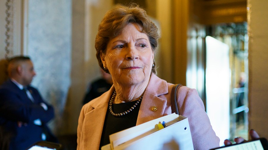 Senator Jeanne Shaheen speaks to a reporter.