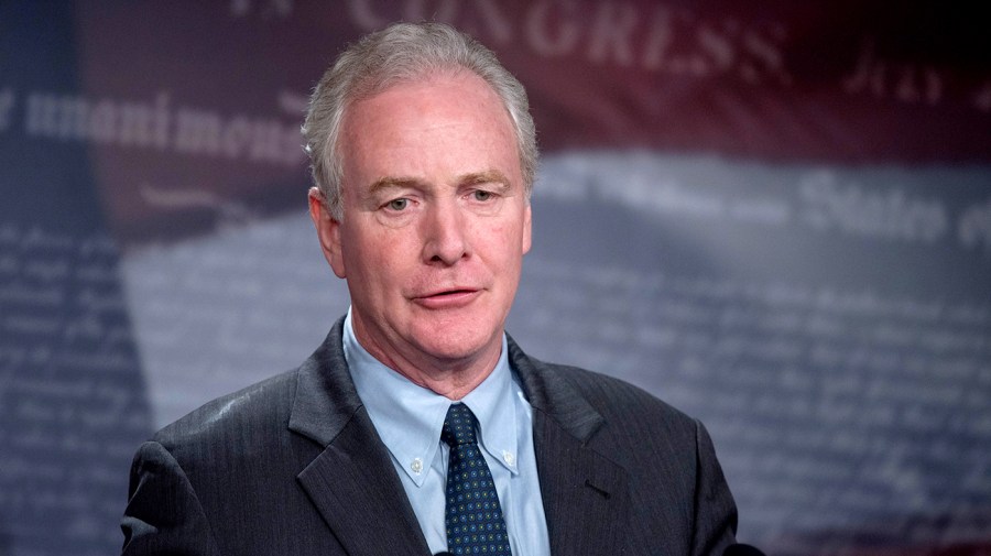 Senator Chris Van Hollen addresses reporters.