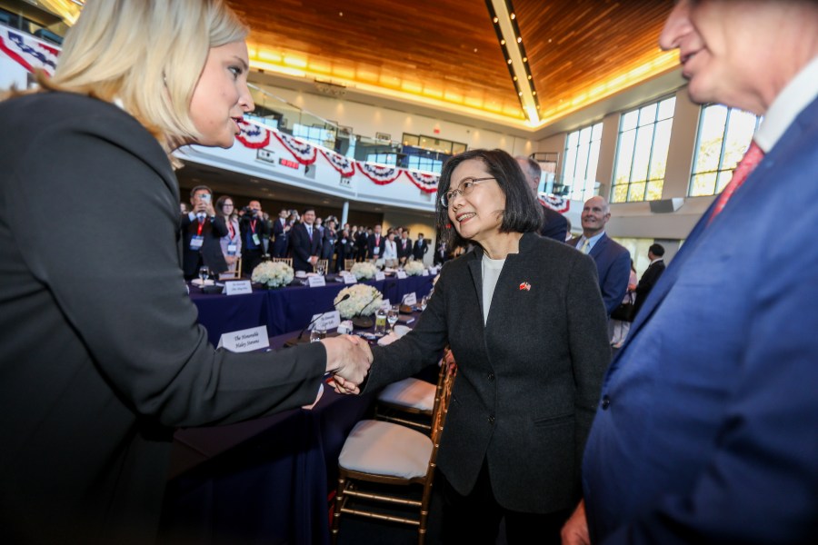 FILE- Taiwan President Tsai Ing-wen, center, is greeted before a Bipartisan Leadership Meeting at the Ronald Reagan Presidential Library in Simi Valley, Calif., on April 5, 2023. China is imposing sanctions against the Ronald Reagan Presidential Library and other U.S.- and Asian-based organizations in retaliation for the closely watched meeting this week between the U.S. House Speaker and Taiwan’s president. (AP Photo/Ringo H.W. Chiu, File)