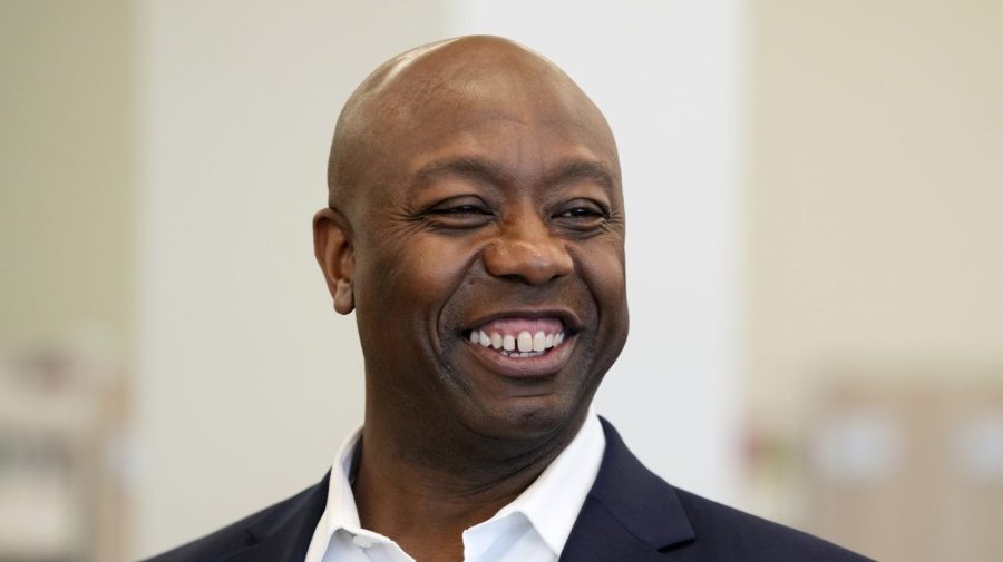 Sen. Tim Scott, R-S.C., tours the Marion Public Library, Wednesday, April 12, 2023, in Marion, Iowa. Scott on Wednesday launched an exploratory committee for a 2024 GOP presidential bid, a step that comes just shy of making his campaign official. (AP Photo/Charlie Neibergall)