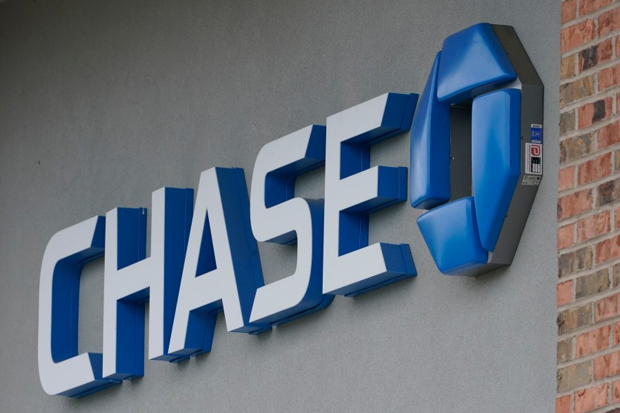 A Chase bank sign in Richmond, Va., Wednesday, June 2, 2021. PMorgan reports earnings on Friday, April 14, 2023. (AP Photo/Steve Helber, File)