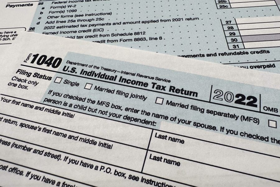 The Internal Revenue Service 1040 tax form for 2022 is photographed, Monday, April 17, 2023. The IRS says it has answered 2 million more calls this tax filing season than a year ago, with the average phone wait time now at four minutes. That's down considerably from 27 minutes for the 2022 tax season. (AP Photo/Jon Elswick)