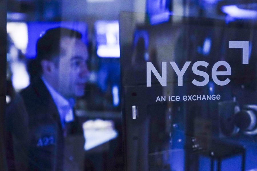 FILE - Traders work on the floor at the New York Stock Exchange in New York, Tuesday, Oct. 4, 2022. (AP Photo/Seth Wenig, File)