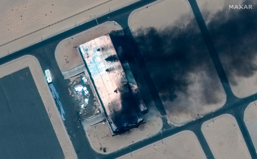 This satellite image provided by Maxar Technologies shows a burning building at Merowe Airbase on Tuesday April 18, 2023 north of Khartoum, Sudan. (Satellite image ©2023 Maxar Technologies via AP)