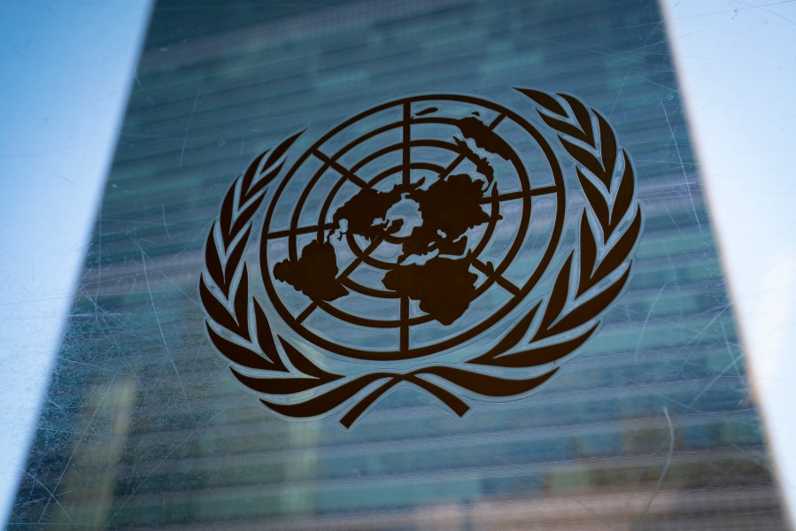 FILE - The symbol of the United Nations is displayed outside the Secretariat Building, Feb. 28, 2022, at United Nations Headquarters. (AP Photo/John Minchillo, File)