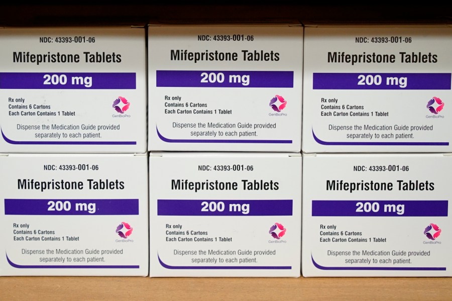 FILE - Boxes of the drug mifepristone sit on a shelf at the West Alabama Women's Center in Tuscaloosa, Ala., on March 16, 2022. The Supreme Court is deciding whether women will face restrictions in getting a drug used in the most common method of abortion in the United States, while a lawsuit continues. (AP Photo/Allen G. Breed, File)