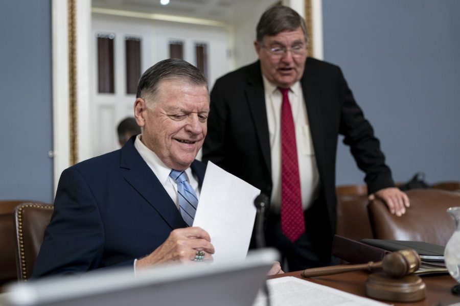 House Rules Committee Chairman Tom Cole, R-Okla., left, speaks with Rep. Michael Burgess, R-Texas, as the panel prepares Republican legislation that would prohibit transgender women and girls from playing on sports teams that match their gender identity, at the Capitol in Washington, Monday, April 17, 2023. The Protection of Women and Girls in Sports Act of 2023 would amend Title IX, the federal education law that bars sex-based discrimination, to define sex as based solely on a person's reproductive biology and genetics at birth. (AP Photo/J. Scott Applewhite)