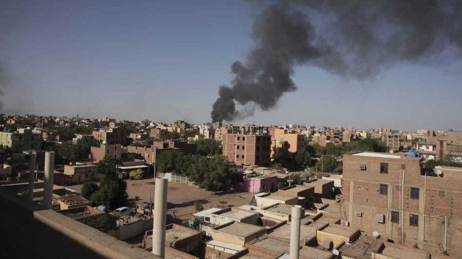 Smoke is seen in Khartoum, Sudan, Wednesday, April 19, 2023. Terrified Sudanese are fleeing their homes in the capital Khartoum, witnesses say, after an internationally brokered cease-fire failed and rival forces battled in the capital for a fifth day. (AP Photo/Marwan Ali)