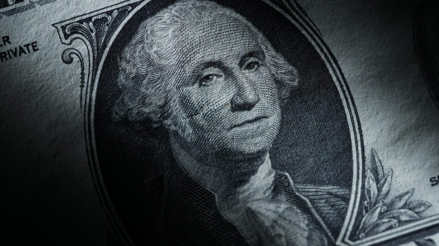 The likeness of George Washington is seen on a U.S. one dollar bill, Monday, March 13, 2023, in Marple Township, Pa. After years of paying low rates for savers, banks are finally offering better interest on deposits. Moving your savings around by opening a new account and closing an old one can seem like a hassle, but it's a use of time that can pay off. (AP Photo/Matt Slocum)