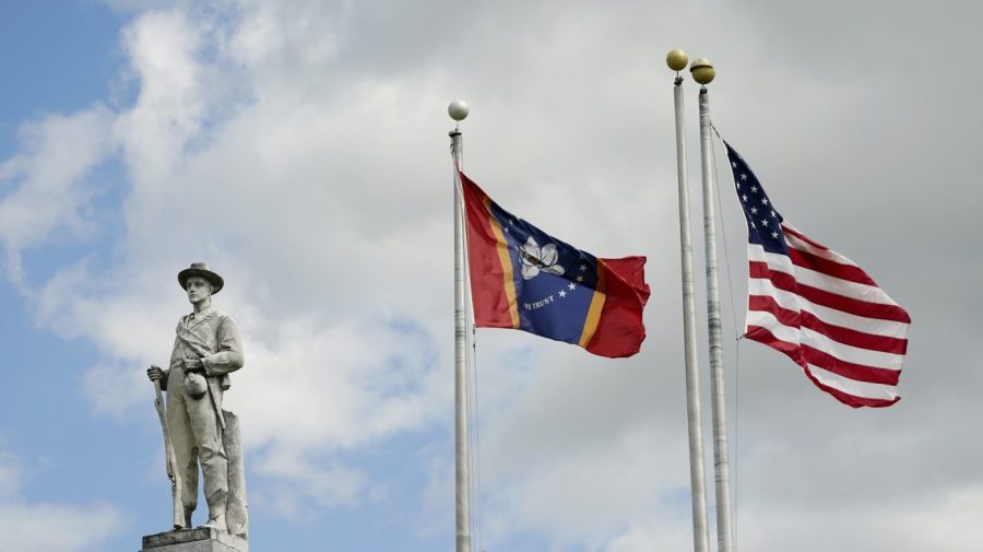 FILE - The Mississippi state and U.S. flags fly near the Rankin County Confederate Monument in the downtown square of Brandon, Miss., on March 3, 2023. Mississippi and Alabama closed most government offices Monday, April 24, for Confederate Memorial Day as efforts have stalled to abolish state holidays that honor the old Confederacy. (AP Photo/Rogelio V. Solis, File)