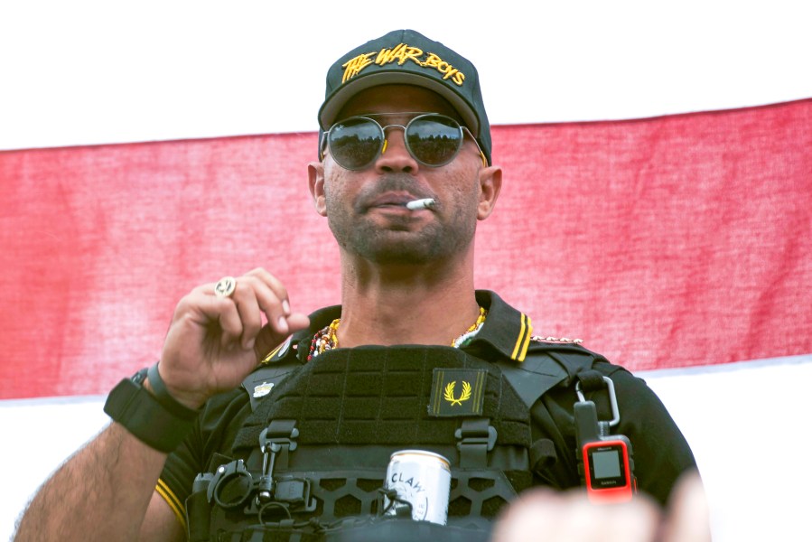 FILE - Proud Boys leader Henry "Enrique" Tarrio wears a hat that says The War Boys during a rally in Portland, Ore., Sept. 26, 2020. A federal jury is set to hear closing arguments in the historic trial of Proud Boys extremist group leaders charged with plotting to use force to keep former President Donald Trump in power. Starting Monday, April 24, 2023, prosecutors and defense lawyers will make their final appeals to jurors who will decide the fate of former Proud Boys national chairman Enrique Tarrio and four lieutenants. (AP Photo/Allison Dinner, File)