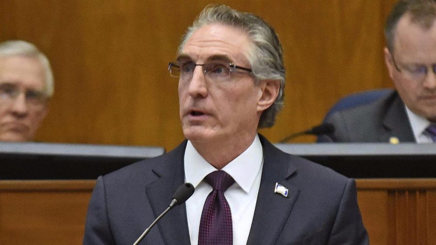 FILE - North Dakota Gov. Doug Burgum delivers his budget address before a joint session of the North Dakota Legislature in Bismarck, N.D., Dec. 5, 2018. Burgum signed a bill Monday, April 24, 2023, that limits access to bathrooms, locker rooms and shower rooms for transgender and gender-nonconforming people in several state facilities. (Tom Stromme/The Bismarck Tribune via AP, File)