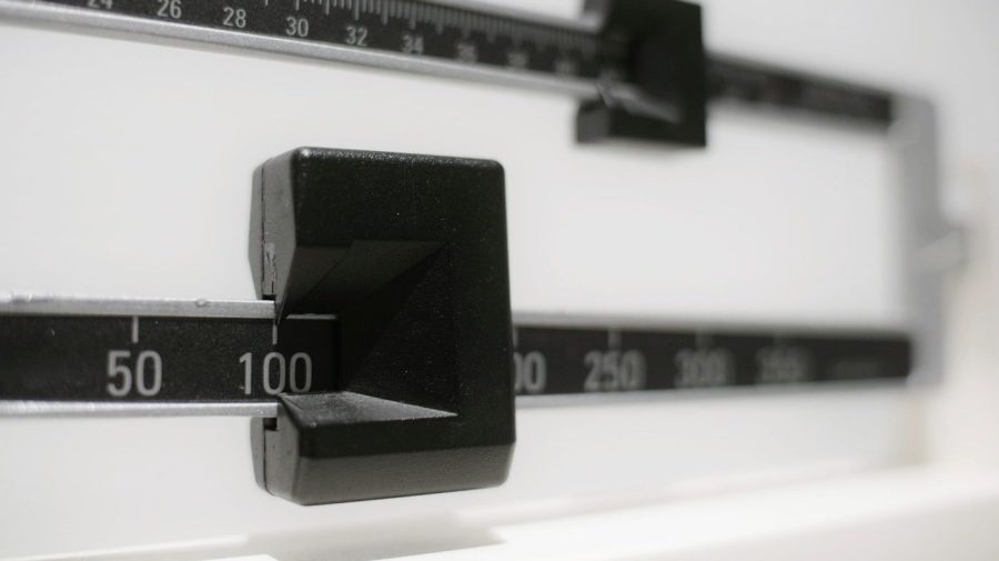 FILE- A closeup of a beam scale is seen in New York on April 3, 2018. Tirzepatide, a drug from Eli Lilly and Co. approved to treat type 2 diabetes under the brand name Mounjaro, helped people with the disease who were overweight or had obesity lose up to 16% of their body weight, or more than 34 pounds, over nearly 17 months, the company said on Thursday, April 27, 2023. (AP Photo/Patrick Sison, File)