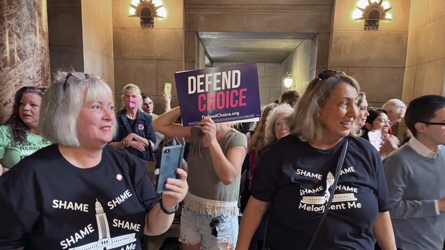 Pat Neal, left, and Ann Fintell, both of Lincoln, celebrate in the Nebraska Capitol rotunda after the failure of a bill that would have banned abortion around the sixth week of pregnancy, Thursday, April 27, 2023 in Lincoln, Neb. The bill is now likely dead for the year, leaving in place a 2010 law that bans abortions at 20 weeks. (AP Photo/Margery Beck)