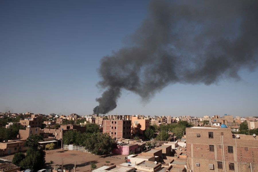 FILE - Smoke is seen in Khartoum, Sudan, Wednesday, April 19, 2023. The U.S. conducted its first organized evacuation of citizens and permanent residents from Sudan, the State Department said Saturday, April 29, two weeks into a conflict that has turned Khartoum into a war zone and thrown the country into turmoil. American unmanned aircraft, which have been keeping an eye on overland evacuation routes for days, were providing armed overwatch for the American operation, according to two people briefed on the operation who were not authorized to speak publicly. (AP Photo/Marwan Ali, File)