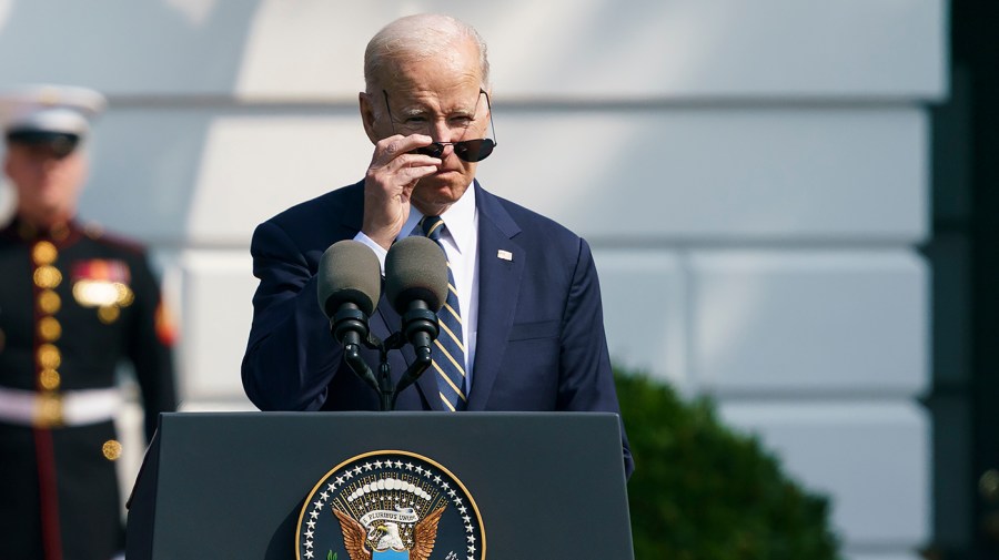 President Biden removes his sun glasses