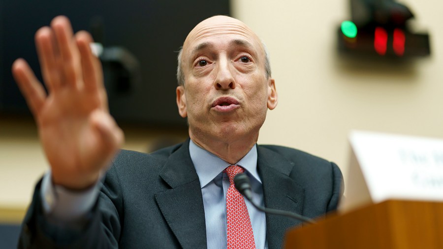 Securities and Exchange Commission Chair Gary Gensler gestures while answering a question during a congressional hearing.