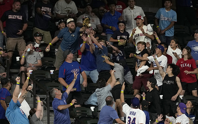 Fans reach out trying to catch a grand slam ball