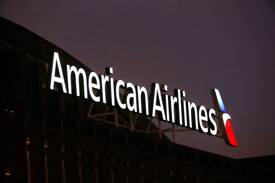 FILE - The American Airlines logo on top of the American Airlines Center in Dallas, Texas, is pictured on Dec. 19, 2017. Pilots at American Airlines are voting to authorize a strike. That doesn't mean they're going to walk off the job anytime soon, but it does aim to put more pressure on the airline to reach a new contract with the pilots' union. The union said Monday, May 1, 2023 that almost all its members took part in the voting, and that 99% of those who voted authorized the union to call for a strike. (AP Photo/Michael Ainsworth, File)