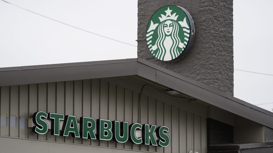 A Starbucks sign and logo is see on one of its stores.