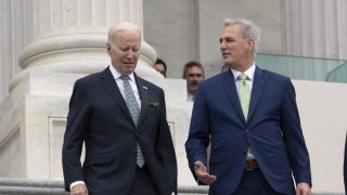FILE - President Joe Biden walks with House Speaker Kevin McCarthy, R-Calif., as he departs the Capitol following the annual St. Patrick's Day gathering, in Washington, Friday, March 17, 2023. Facing the risk of a government default as soon as June 1, President Joe Biden has invited the top four congressional leaders to a White House meeting for talks. (AP Photo/J. Scott Applewhite, File)
