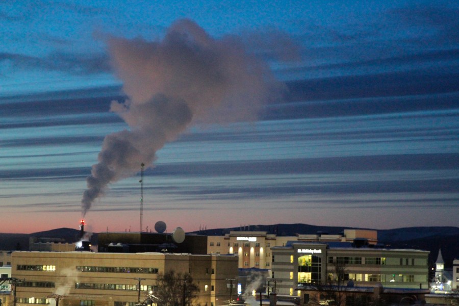 FILE - A plume of smoke being emitted into the air from a power plant, Feb. 16, 2022, in Fairbanks, Alaska. The Biden administration is proposing new limits on greenhouse gas emissions from coal- and gas-fired power plants, its most ambitious effort yet to reduce planet-warming pollution from the nation’s second-largest contributor to climate change. A rule being unveiled Thursday by the Environmental Protection Agency could force power plants to capture smokestack emissions using technology that isn't in widespread use in the U.S. (AP Photo/Mark Thiessen, File)