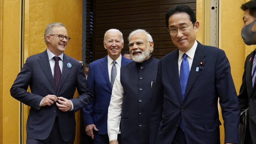 FILE - From left, Australian Prime Minister Anthony Albanese, U.S. President Joe Biden and Indian Prime Minister Narendra Modi are greeted by Japanese Prime Minister Fumio Kishida, right, during their arrival to the Quad leaders summit at Kantei Palace, May 24, 2022, in Tokyo. Biden has an ambitious agenda when he sets off later this week on an eight-day trip to the Indo-Pacific. For part of his trip Biden will travel to Australia for a summit with fellow Quad leaders. (AP Photo/Evan Vucci, File)