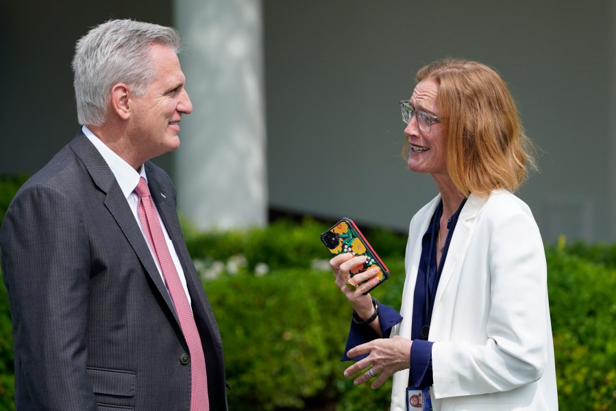 FILE - House Speaker Kevin McCarthy of Calif., left, talks with White House director of legislative affairs Louisa Terrell, right, before the start of an event in the Rose Garden of the White House in Washington, July 26, 2021. President Joe Biden and McCarthy are turning to a select group of negotiators to help broker a deal to increase the nation’s borrowing authority. (AP Photo/Susan Walsh, File)