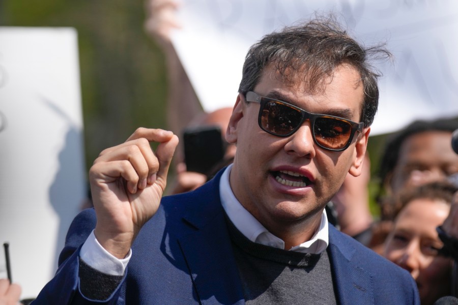 U.S. Rep. George Santos speaks to reporters as he leaves the federal courthouse in Central Islip, N.Y., Wednesday, May 10, 2023. A 13-count federal indictment unsealed in New York accuses Santos of embezzling money from his campaign, falsely receiving unemployment funds and lying to Congress about his finances. (AP Photo/Seth Wenig)