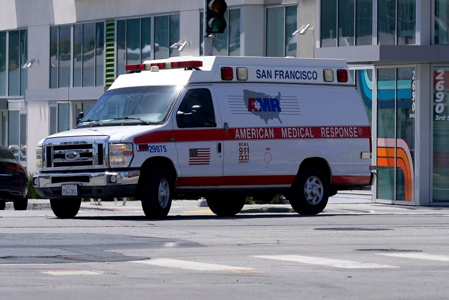 An American Medical Response vehicle drives in San Francisco, Monday, May 22, 2023. Lawyers sued medical transport provider American Medical Response West, saying the ambulance company's lax oversight allowed a paramedic to sexually assault two women in their 80s on their way to a hospital. (AP Photo/Jeff Chiu)