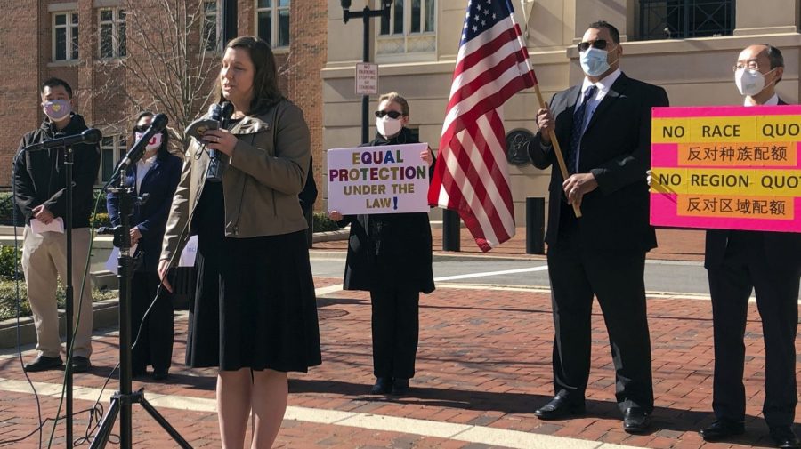 FILE - Pacific Legal Foundation attorney Erin Wilcox speaks at a news conference outside the federal courthouse on March 10, 2021, in Alexandria, Va., where her organization filed a lawsuit against Fairfax County's school board, alleging discrimination against Asian Americans over its revised admissions process for the elite Thomas Jefferson High School for Science and Technology. A divided federal appeals court on Tuesday, May 23, 2023, upheld the constitutionality of a new admissions policy at the elite public high school in Virginia that critics say discriminates against highly qualified Asian Americans. (AP Photo/Matthew Barakat, File)