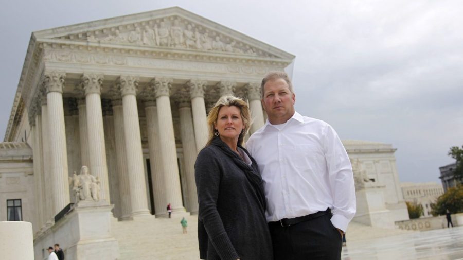 FILE - Michael and Chantell Sackett of Priest Lake, Idaho, pose for a photo in front of the Supreme Court in Washington on Oct. 14, 2011. The Supreme Court on Thursday, May 25, 2023, made it harder for the federal government to police water pollution in a decision that strips protections from wetlands that are isolated from larger bodies of water. The justices boosted property rights over concerns about clean water in a ruling in favor of an Idaho couple who sought to build a house near Priest Lake in the state’s panhandle. (AP Photo/Haraz N. Ghanbari, File)