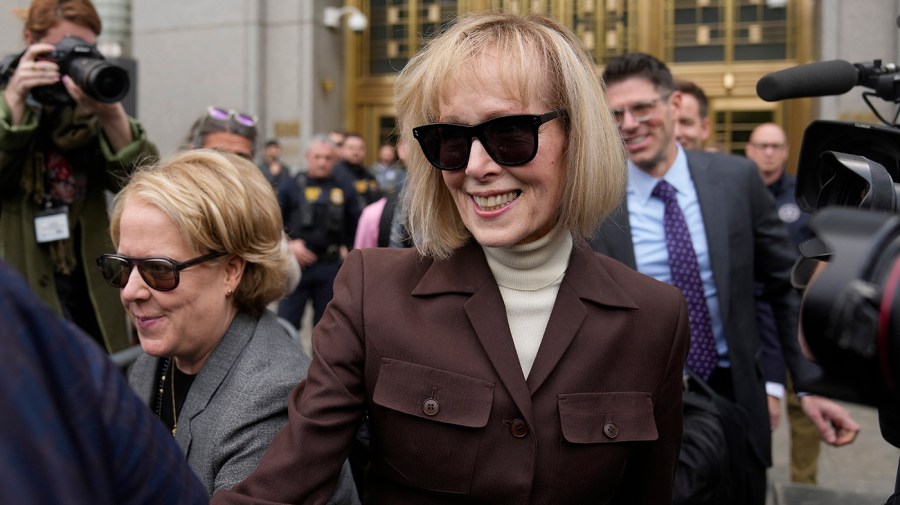 E. Jean Carroll, center, walks out of Manhattan federal court, Tuesday, May 9, 2023, 2023, in New York.