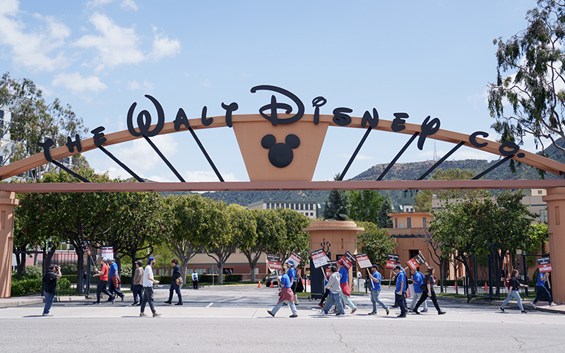 Striking Writers Guild of America workers picket outside the Disney Studios