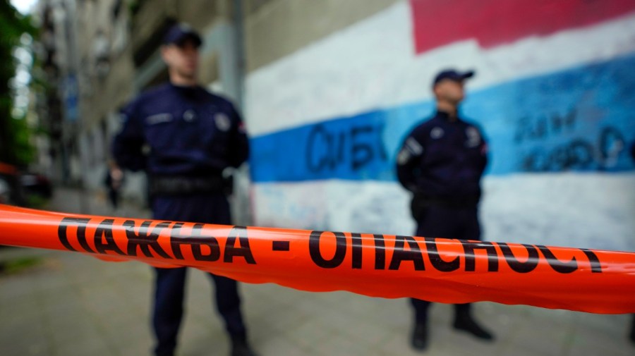 Police block streets around the Vladislav Ribnikar school in Belgrade, Serbia, Wednesday, May 3, 2023. A teenage boy opened fire early Wednesday in a school in central Belgrade, causing injuries.