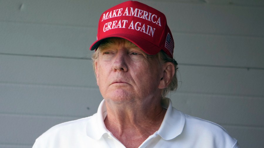 Former President Trump watches the first round of the LIV Golf Tournament at Trump National Golf Club, Friday, May 26, 2023, in Sterling, Va.