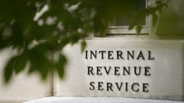 FILE - A sign is displayed outside the Internal Revenue Service building on May 4, 2021, in Washington. While Republicans seek to make good on campaign promises to cut IRS funding through the proposed debt ceiling and budget cuts package now moving through Congress, Democrats are offering assurances that the spending cuts will have little impact on the federal tax collector. (AP Photo/Patrick Semansky, File)