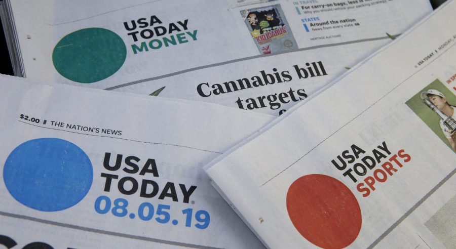 FILE - Sections of a USA Today newspaper are displayed Aug. 5, 2019, in Norwood, Mass. Journalists across the U.S. will walk off their jobs next week at publications owned by Gannett, the largest newspaper chain in the U.S. The mostly one-day strike, which will start Monday, June 5, 2023, aims to protest the company’s leadership and cost-cutting measures imposed since its 2019 merger with GateHouse Media. (AP Photo/Steven Senne, File)