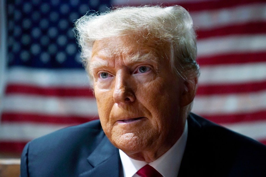 FILE — Former President Donald Trump speaks with supporters at the Westside Conservative Breakfast, June 1, 2023, in Des Moines, Iowa. In a written submission Thursday, June 8, 2023, lawyers for Trump say a $5 million jury award for his sexual abuse and defamation of columnist E. Jean Carroll in a department store dressing room, in 1996, should be slashed to less than $1 million. (AP Photo/Charlie Neibergall, File)