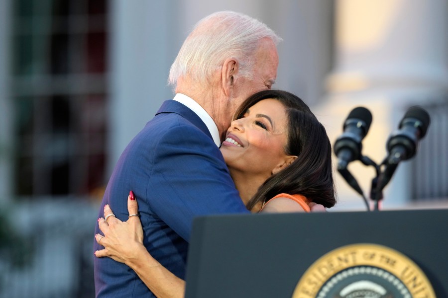 President Joe Biden hugs Eva Longoria before a screening of the film "Flamin' Hot," Thursday, June 15, 2023, on the South Lawn of the White House in Washington. (AP Photo/Jacquelyn Martin)