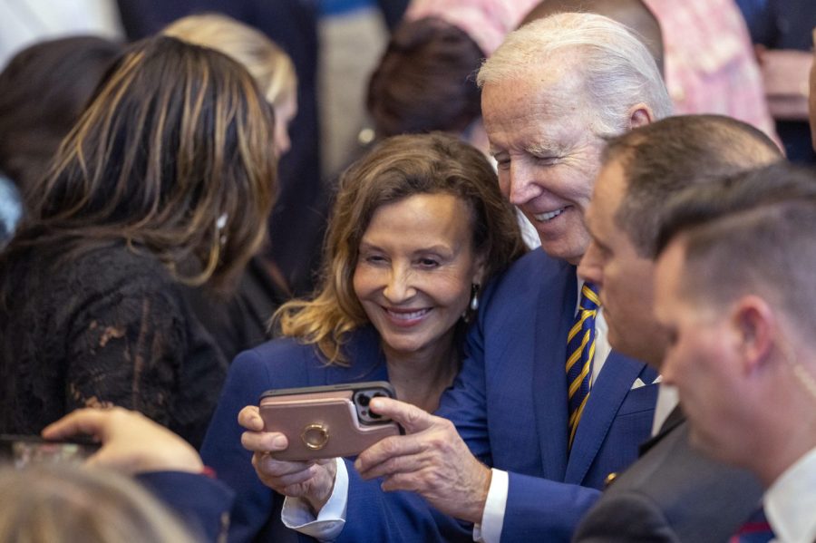 FILE - President Joe Biden takes a selfie after speaking at the IBEW Local 26 union, Feb. 15, 2023, in Lanham, Md. (AP Photo/Alex Brandon, File)