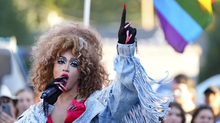 FILE - Lilia performs a Cyndi Lauper song during the RaYnbow Collective hosting a Back to School Pride Night for BYU students at Kiwanis Park in Provo, Utah, on Sept. 3, 2022. A federal judge has granted the request Friday, June 17, 2023, of an Utah-based group that organizes drag performances for a preliminary injunction, directing the city of St. George to issue a permit for the group to host an all-ages drag show in a public park and calling the attempt of city officials to stop the show unconstitutional. (Francisco Kjolseth/The Salt Lake Tribune via AP, File)