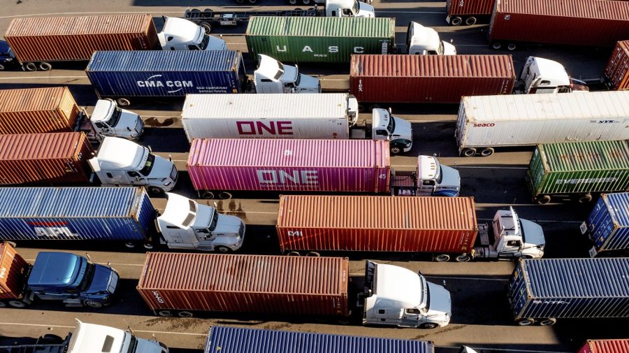 FILE - Trucks line up to enter a Port of Oakland shipping terminal on Nov. 10, 2021, in Oakland, Calif. Conservatives anxious to counter the U.S.’s leading economic adversary have set their sights on a top trade priority for labor unions and progressives: cracking down on the deluge of duty-free packages coming in from China. The changing political dynamic could have major ramifications for small businesses and consumers importing products from China valued at less than $800. (AP Photo/Noah Berger, File)