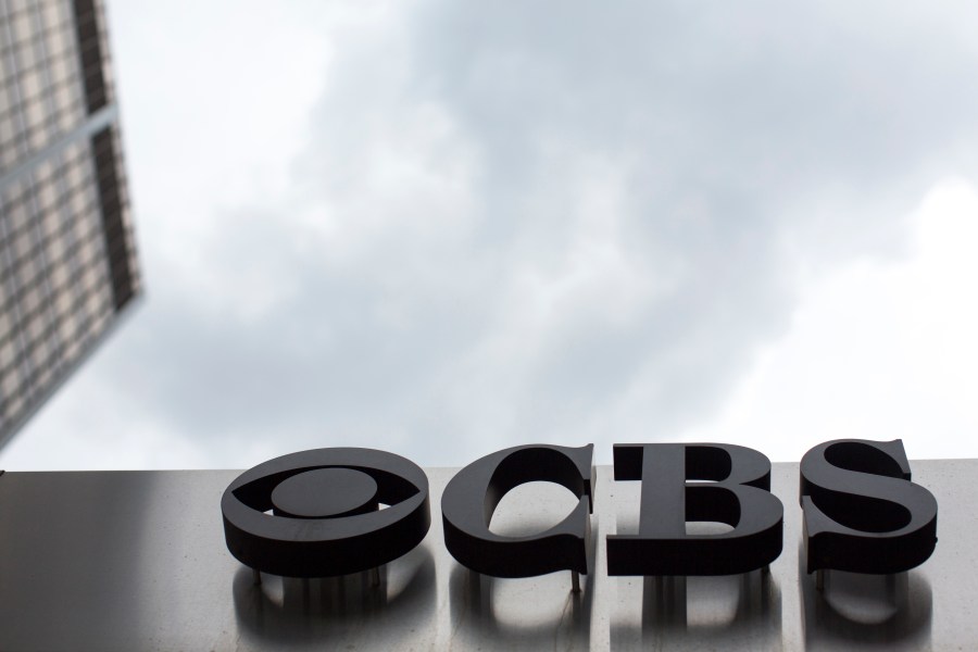 FILE - The CBS logo appears at their broadcast center in New York on May 10, 2017. CBS News has asked all of its local stations to become proficient in “solutions journalism,” a story-telling method that has taken off in the past decade to counter people who think reporters are obsessed with bad news.(AP Photo/Mary Altaffer, File)