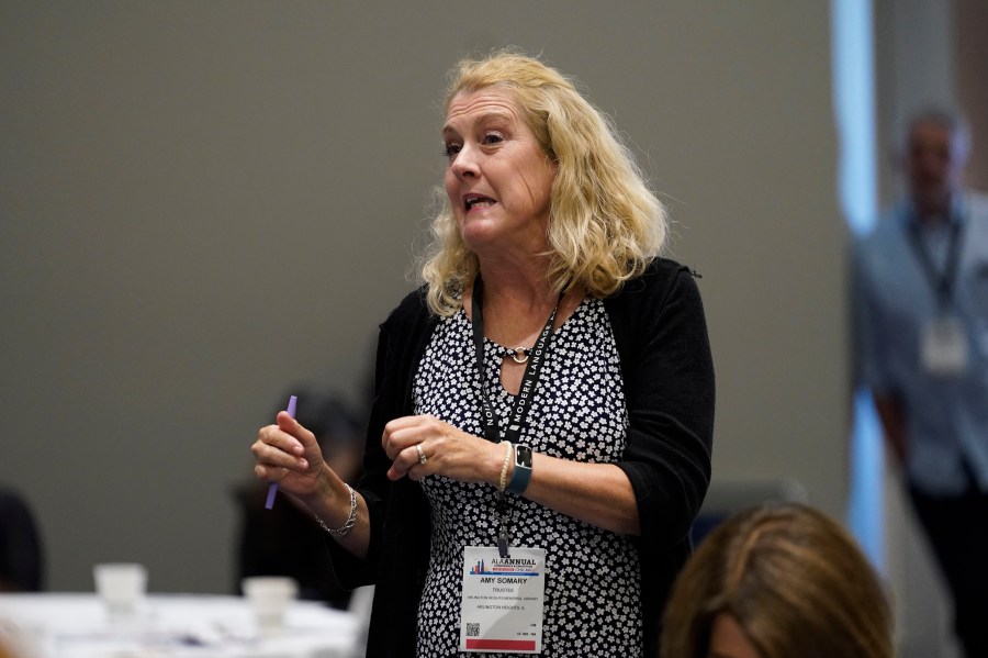 Amy Somary, trustee of the Arlington Heights Memorial Library, asks a question during a panel discussion about understanding and combating book bans at the American Library Association's annual conference and exhibition Friday, June 23, 2023, at McCormick Place in Chicago. (AP Photo/Erin Hooley)