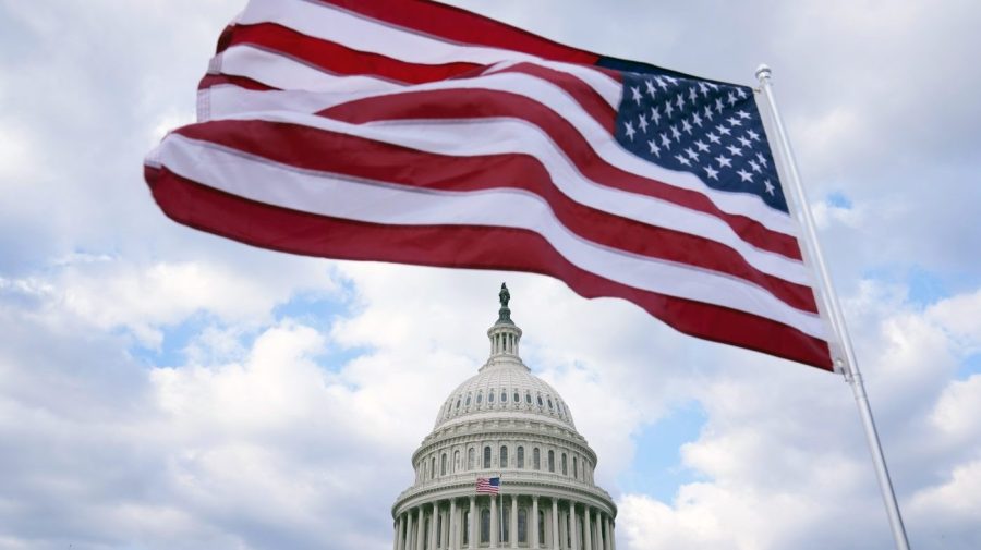 FILE - The U.S. Flag flies at the Capitol in Washington, Feb. 6, 2023. The United States is about to start the countdown to its 250th anniversary. (AP Photo/Mariam Zuhaib, File)